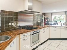Maison de plain-pied, 112m² et 18m² chalet/studio, terrain de 1152m²