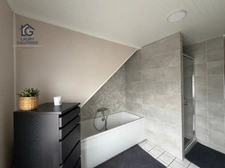 HOUPLINES BOURG — Maison rénovée avec 3 chambres, jardin exposé sud et garage