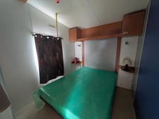 AMBON MOBIL-HOME DE 26m² ENVIRON 2 CHAMBRES AVEC TERRASSE BOIS SUR L'EXTÉRIEUR ET ABRIS DE JARDIN PARCELLE DE 200m² ENVIRON
