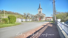 Maison à vendre plain-pied - grand séjour - cuisine récente - 3 chambres - véranda - terrasse - proche de VIGNEULLES LES HATTONCHATE (55)