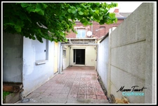 Maison de ville de 110m² avec jardin à fort potentiel - Spécial investisseur ou bricoleur