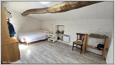 VILLAGE HOUSE for sale, 7 rooms including 5 BEDROOMS, LOULAY (17) with OUTBUILDINGS (garage 54m² + covered area)