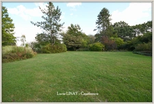 Domaine paysager reconnu avec parc floral, batiments et terres agricoles