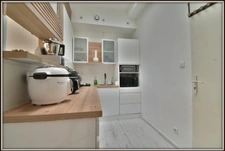  Appartement rénové avec jardin privatif – Vendu entièrement meublé 1 pièces NIMES (30)