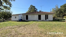 Maison à vendre charmant plain-pied en pierre de taille - 3 chambres - jardin clos et boisé - à FONTCOUVERTE (17100)