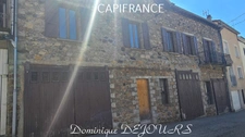 Maison composée de 2 appartements (57 et 43m²) et d'un grand garage de 100m².
