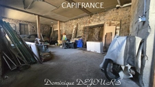 Maison composée de 2 appartements (57 et 43m²) et d'un grand garage de 100m².