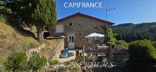Maison en pierres avec deux logements, terrasse et terrain de 7 800 m² – Saint-Jean-Roure (07160)
