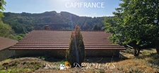 Maison en pierres avec deux logements, terrasse et terrain de 7 800 m² – Saint-Jean-Roure (07160)