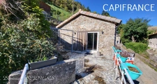 Ardéche, à St Julien du Gua, dans la sauvage et magnifique vallée de l'Auzene, grande maison de 178m² avec très grands sous-sols avec garage et atelier