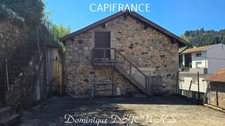 Maison composée de 2 appartements (57 et 43m²) et d'un grand garage de 100m².