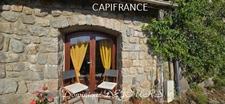 Maison en pierres avec deux logements, terrasse et terrain de 7 800 m² – Saint-Jean-Roure (07160)