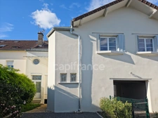 Maison de ville à vendre avec jardin et parking
