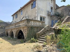 House for sale with 1 four-room apartment (80 m2) + 2 two-room apartments (36 m2) in SAINT JEAN DU GARD (30), land approximately 10719 m2
