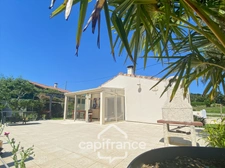 Maison familiale d'environ 100 m2 avec piscine, terrain arboré et grand garage au calme de la campagne ardéchoise