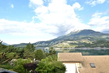 Savines-le-Lac – Appartement rénové avec vue imprenable sur le lac de Serre-Ponçon, balcon et terrasse plein sud