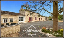 Maison en pierre à vendre 6 pièces 4 chambres + studio indépendant sur terrain 3 260 m² avec dépendances Champigny-En-Rochereau (86)