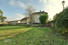 Maison de Maître avec jardin et garage.