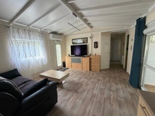SAINT CYR EN TALMONDAIS (85) DANS RESIDENCE AVEC PISCINE CHALET BOIS 3 CHAMBRES AVEC VERANDA ET JARDIN