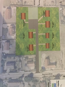 Au calme, cœur de village, terrain constructible et viabilisé de 911 m2 