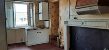 MAISON MITOYENNE PLAIN PIED AVEC POTENTIEL D'AMÉNAGEMENT.