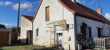MAISON MITOYENNE PLAIN PIED AVEC POTENTIEL D'AMÉNAGEMENT.