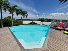 VUE MER Superbe villa de standing + T3 piscine à débordement sur 1000 m² à BAIE MAHAULT (971)