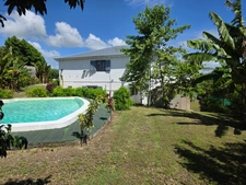 Charming house + 2-bedroom apartment and studio with small pool and distant sea view in Sainte Anne (971)