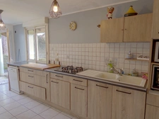 Villa d'environ 112 M2, proche commerces, jardin devant pour 950 M2, puits, garage attenant de 30 M2