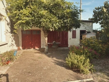 Maison à vendre 3 pièces, jardin avec puits de 690 M2, ateliers, garages.