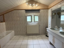 PAVILLON INDIVIDUEL SUR SOUS-SOL SEMI-ENTERRÉ