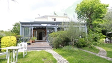 Belle maison bourgeoise avec spacieuse véranda et 2 bureaux/ateliers sur un terrain de 980 m2