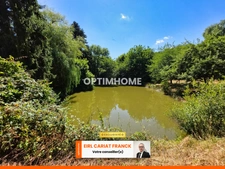 MAISON EN PIERRE DE SEMI PLAIN-PIED DE 86 M2, L’ENSEMBLE SUR 4560 M² DE TERRAIN CLOS AVEC DES DÉPENDANCES >