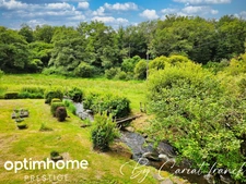 ANCIEN MOULIN DE 160 M², L’ENSEMBLE SUR SON PARC 3755 M² DE TERRAIN CLOS :