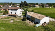 Maison avec grands volumes et fort potentiel sur Grièges – Terrain de plus de 4 000 m²