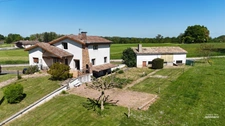Maison avec grands volumes et fort potentiel sur Grièges – Terrain de plus de 4 000 m²
