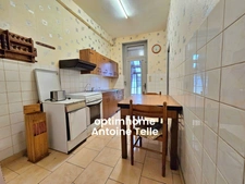 Le Cateau - Maison semi-individuelle à double accès avec garage, devanture & jardin clos sur 960m².