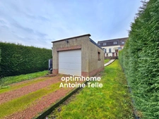 Le Cateau - Maison semi-individuelle à double accès avec garage, devanture & jardin clos sur 960m².