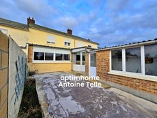 Le Cateau - Maison GMF de 3/4 chambres avec devanture, garage, terrasse et jardin.