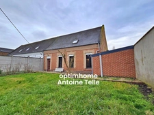 Le Cateau - Maison semi-individuelle à double accès avec garage, devanture & jardin clos sur 960m².