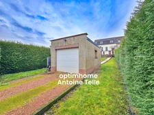Le Cateau - Maison semi-individuelle à double accès avec garage, devanture & jardin clos sur 960m².
