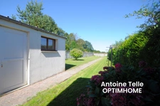 Maison individuelle bâtie sur 700m² - 3 voire 4 chambres, garages, remise et jardin clos