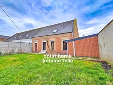 Le Cateau - Maison semi-individuelle à double accès avec garage, devanture & jardin clos sur 960m².