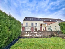 Le Cateau - Maison semi-individuelle à double accès avec garage, devanture & jardin clos sur 960m².