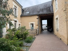 Immeuble en centre ville de Parigné l’évêque 