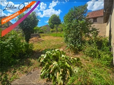 Maison à rénover avec cour, grand garage et terrain constructible