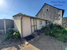 Maison avec jardin, dépendances et garage 