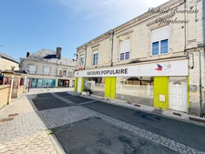 Immeuble de rapport avec local commercial et deux logements – Opportunité d'investissement