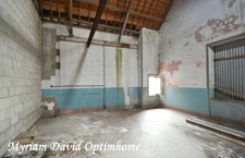 Maison composée de deux parties d’habitation avec grand garage à Kergrist-Moëlou