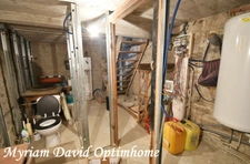 Maison composée de deux parties d’habitation avec grand garage à Kergrist-Moëlou